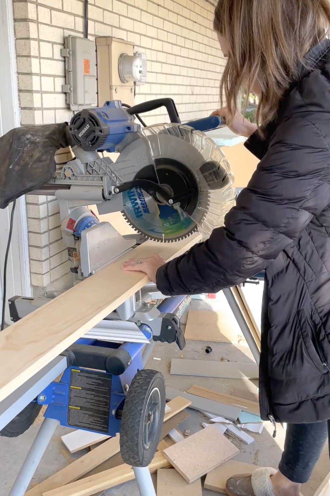 Cutting trim boards using a miter saw. 